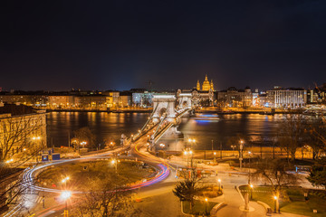 Night View of the Szechenyi Chain Bridge and church St. Stephen's Basilica in Budapest