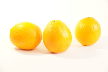 Ripe juicy orange isolated on a striped background