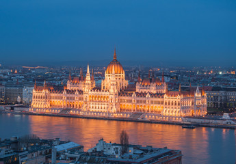 Fototapeta na wymiar Evening view of the Hungarian Parliament Building on the bank of the Danube in Budapest, Hungary