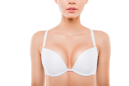 Close up of  sexy woman with perfect chest in white bra