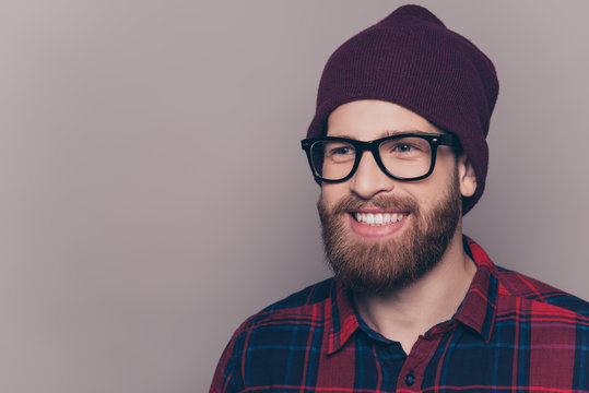 Cheerful bearded hipster man in glasses with beaming smile