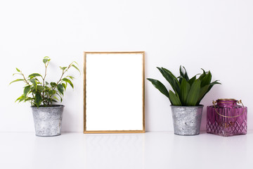 Golden frame mock-up on white wall
