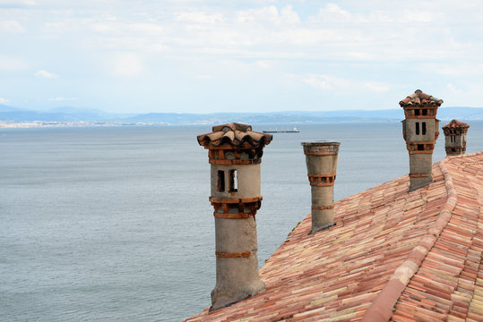 Roof tiles and chimneys on Duino castle.
