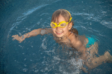 Little girl in the swimming pool