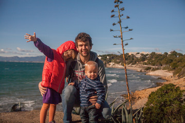 Fototapeta na wymiar Family near the sea coast in Salou