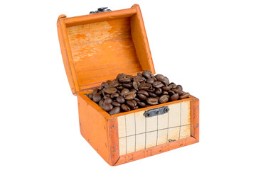Coffee beans in chest on white close up