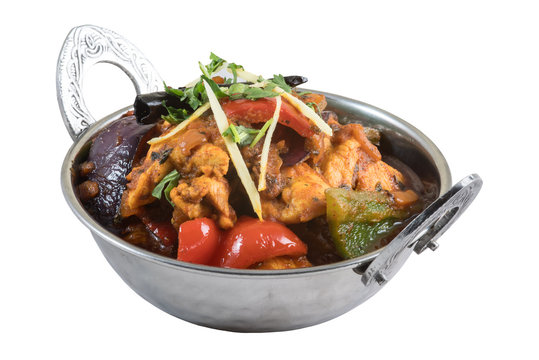 Kadai chicken indian main course meal in metal bowl isolated on white background