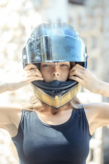 Pretty girl biker in motorcycle helmet