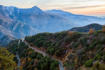 Winding mountain road at sunset