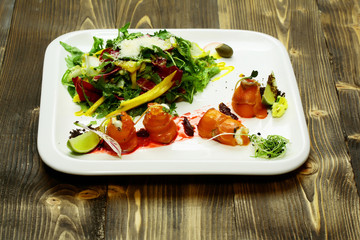 Red fish rolls and salad