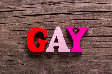 gay word made of wooden letters