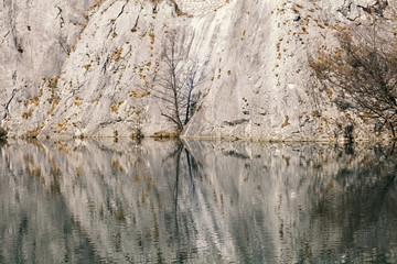 Reflection stone walls in the water