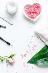 salt and cream for nail care in spa top view