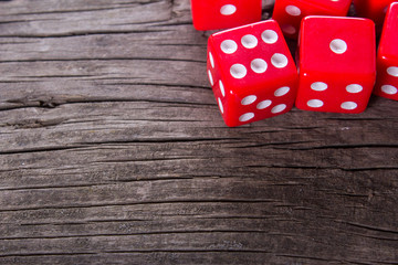 red dice on a wooden table