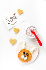 concept kid breakfast with pancake top view on white background