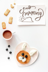 Fototapeta na wymiar concept kid breakfast with pancake top view on white background