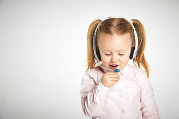 Young cheerful female customer support operator with headset and smiling