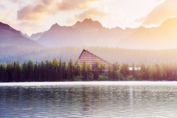 The sunrise over a lake in the park High Tatras.