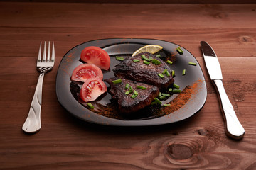 fried steak on a wooden table