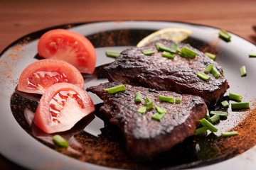 fried steak on a wooden table