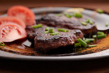 fried steak on a wooden table