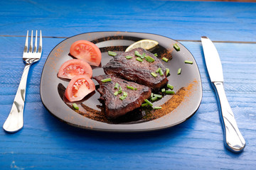 fried steak on a wooden table