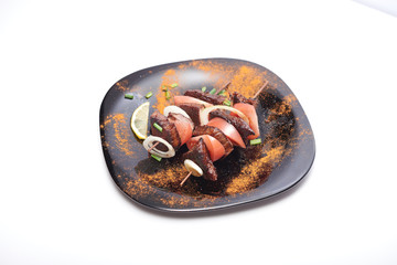 shish kebab on a plate on a white background