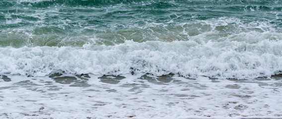Waves on the beach sand