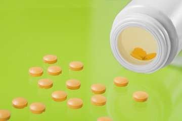 pile of medical pills and bank on glass background