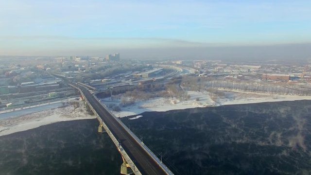 Aerial view from the air. Winter. Irkutsk city. Russia. Siberia. View of the bridge across the Angara River