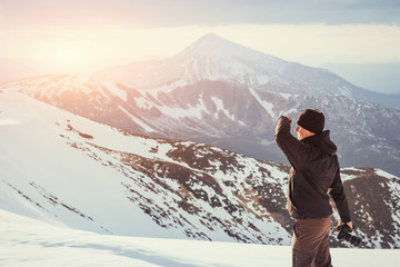 tourist looks at the landscape. Beautiful sunset