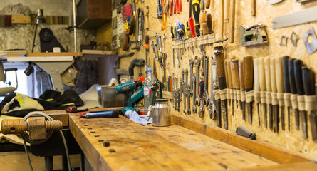 work tools and workbench at workshop - obrazy, fototapety, plakaty