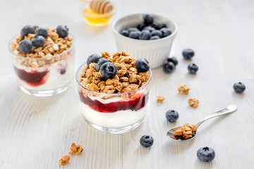 Healthy morning with granola breakfast on white kitchen table