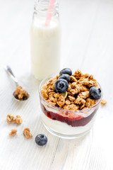 Healthy morning with granola breakfast on white kitchen table