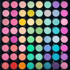 Colorful makeup palette background. Flat lay