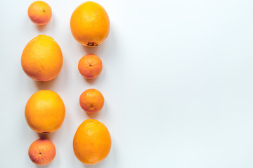 Orange fruits on white background top view mock up