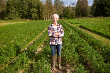happy senior woman at farm