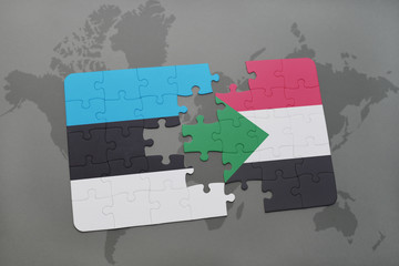 puzzle with the national flag of estonia and sudan on a world map
