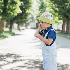 Cute boy posing for photo outdoors Ukraine. Europe