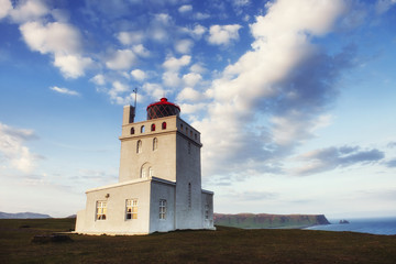 Fototapeta na wymiar Beautiful white lighthouse at Cape Dyrholaey, South Iceland.