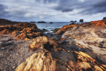 Reynisfjara black sand beach in Iceland. Reynisfyal Mountains