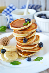 Pancakes for breakfast with honey and blueberries 