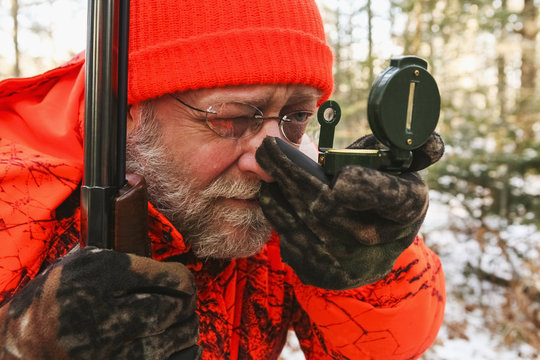 Big Game Hunter Using Compass in winter