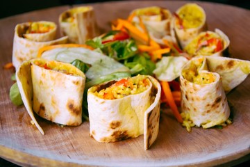 Tortilla wraps with rice and vegetables. Healthy vegetarian food.