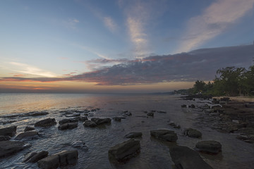 Sunset on the beach .