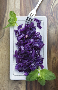 Purple Sauerkraut made with apples and vinegar, and plated with mint leaves for a gourmet meal