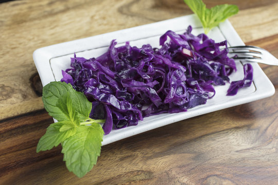 Purple Sauerkraut made with apples and vinegar, and plated with mint leaves for a gourmet meal