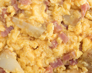 Cooked ham eggs and potatoes breakfast close view.