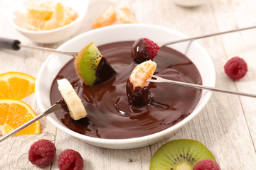 fruit dipping in chocolate sauce