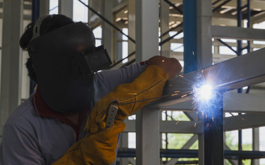 Welders were welding steel structural by arc welding, Steel fabrication industry.